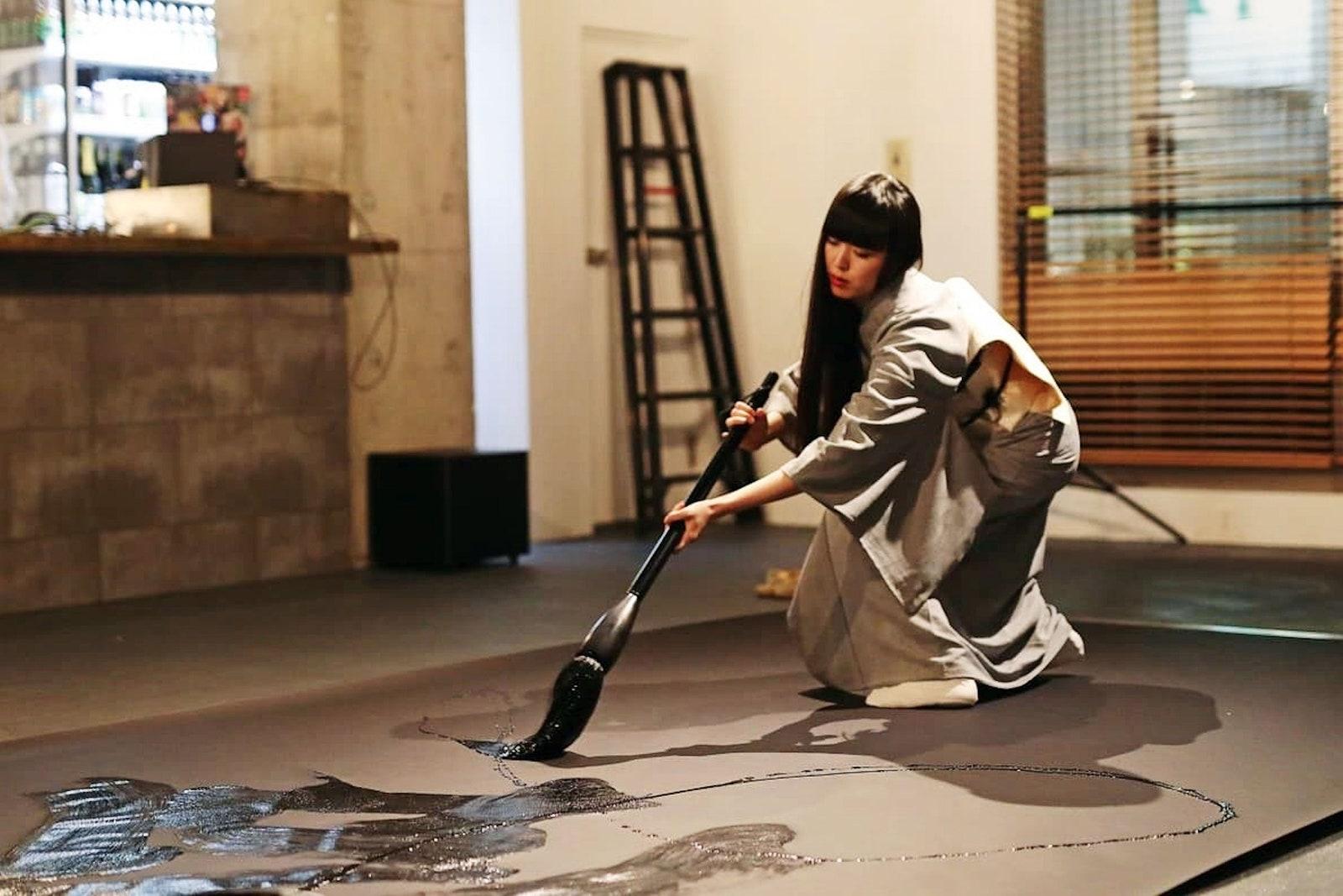 Calligraphy artist Mami at work